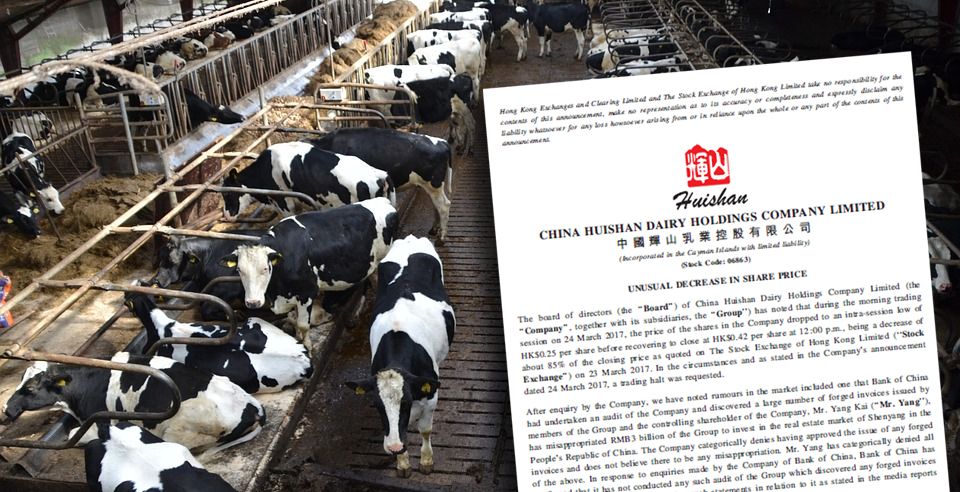 Regulators put Chinese dairy titan's shares on lockdown