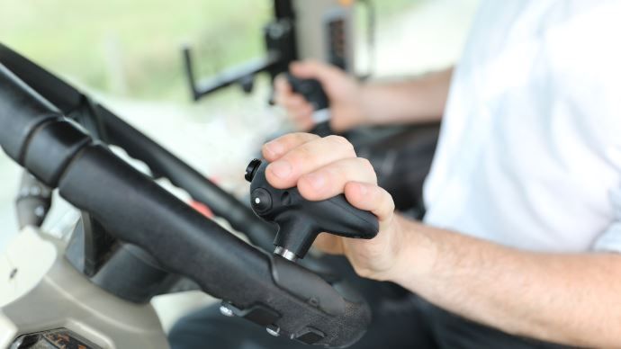 Clever steering knob that 'transforms' tractor/loader work