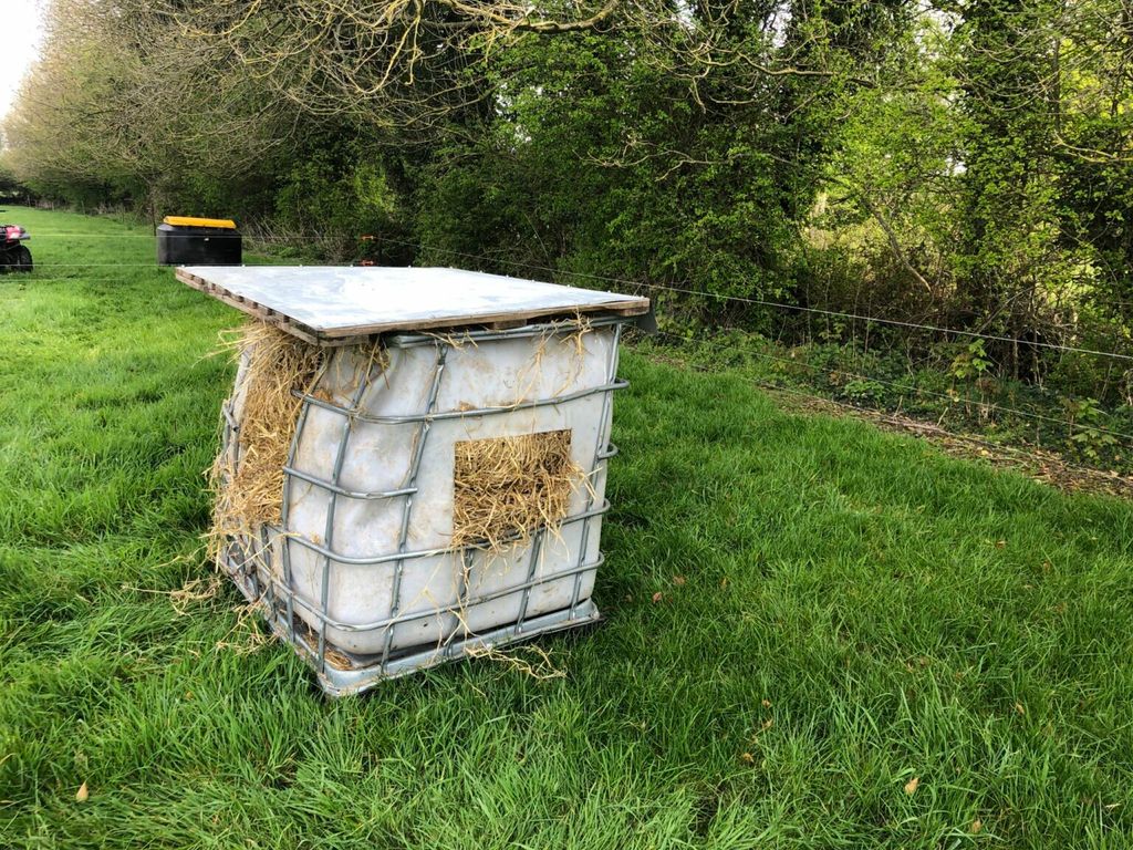 A simple idea whereby hay or straw is offered in a converted IBC tank