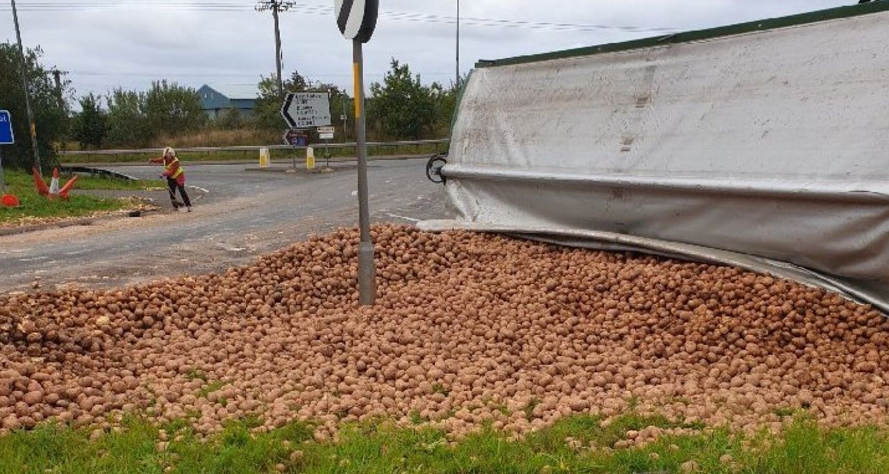 Trailer transporting potatoes overturns on Scottish road