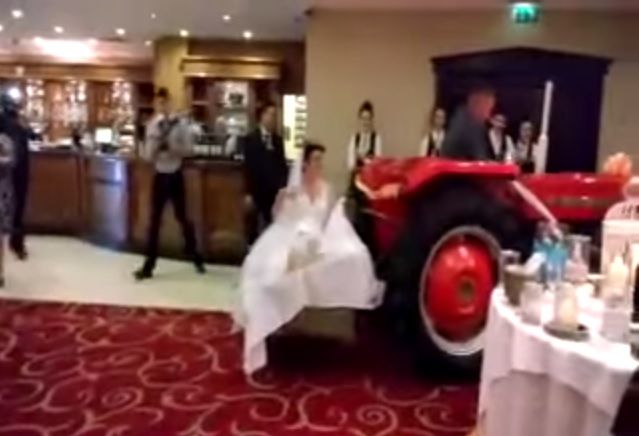 Video: A bride arrived to her wedding reception on a transport box