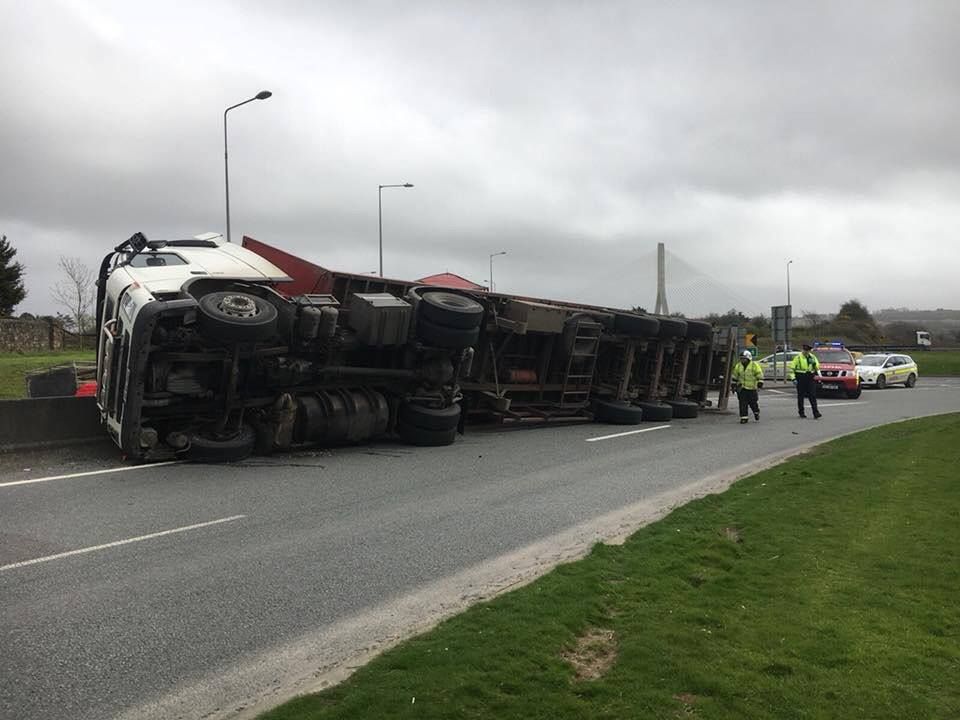 Overturned lorry scatters chickens onto motorway