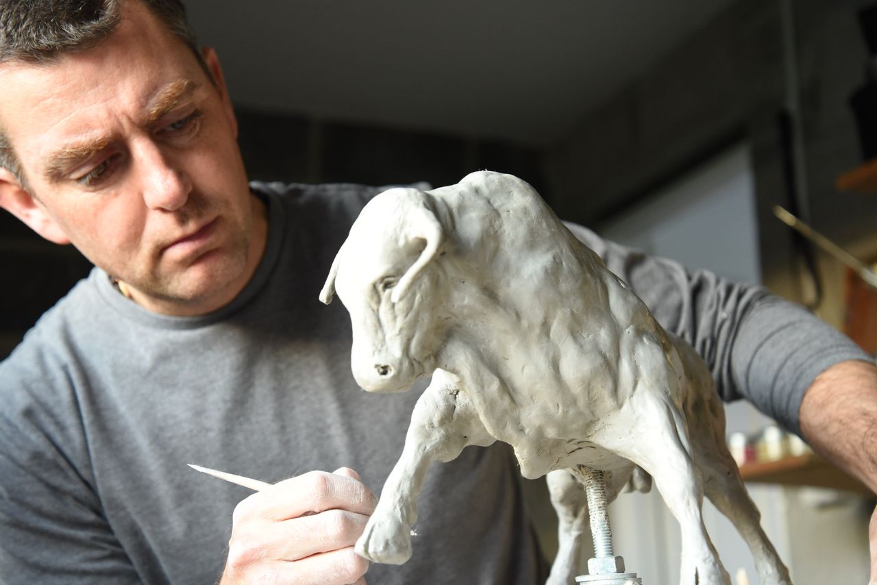 Sculpture depicting bulls and cattle carves out niche for artist