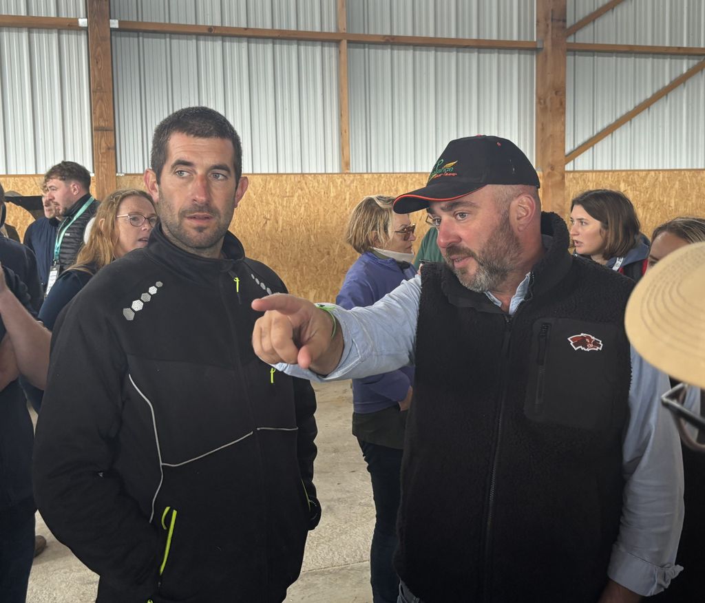 Olivier Rambert (right) translating the farm information