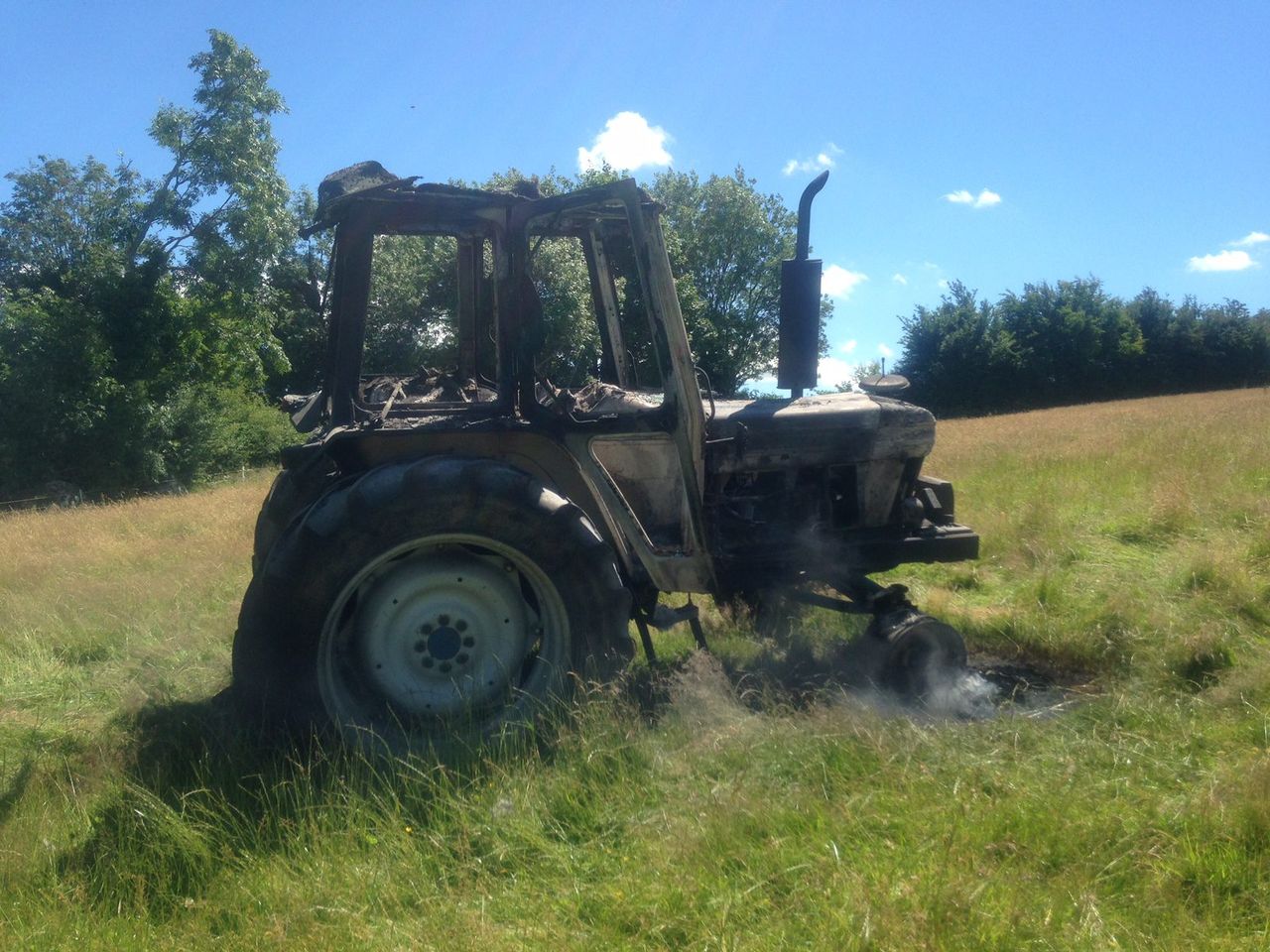 Contractor has lucky escape as tractor goes on fire in hay field