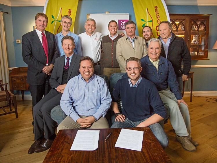 Luis Silva, Cooprinsem, and Matthew Shine, SAMCO, sign the €1.5 million deal in the Dunraven Arms
