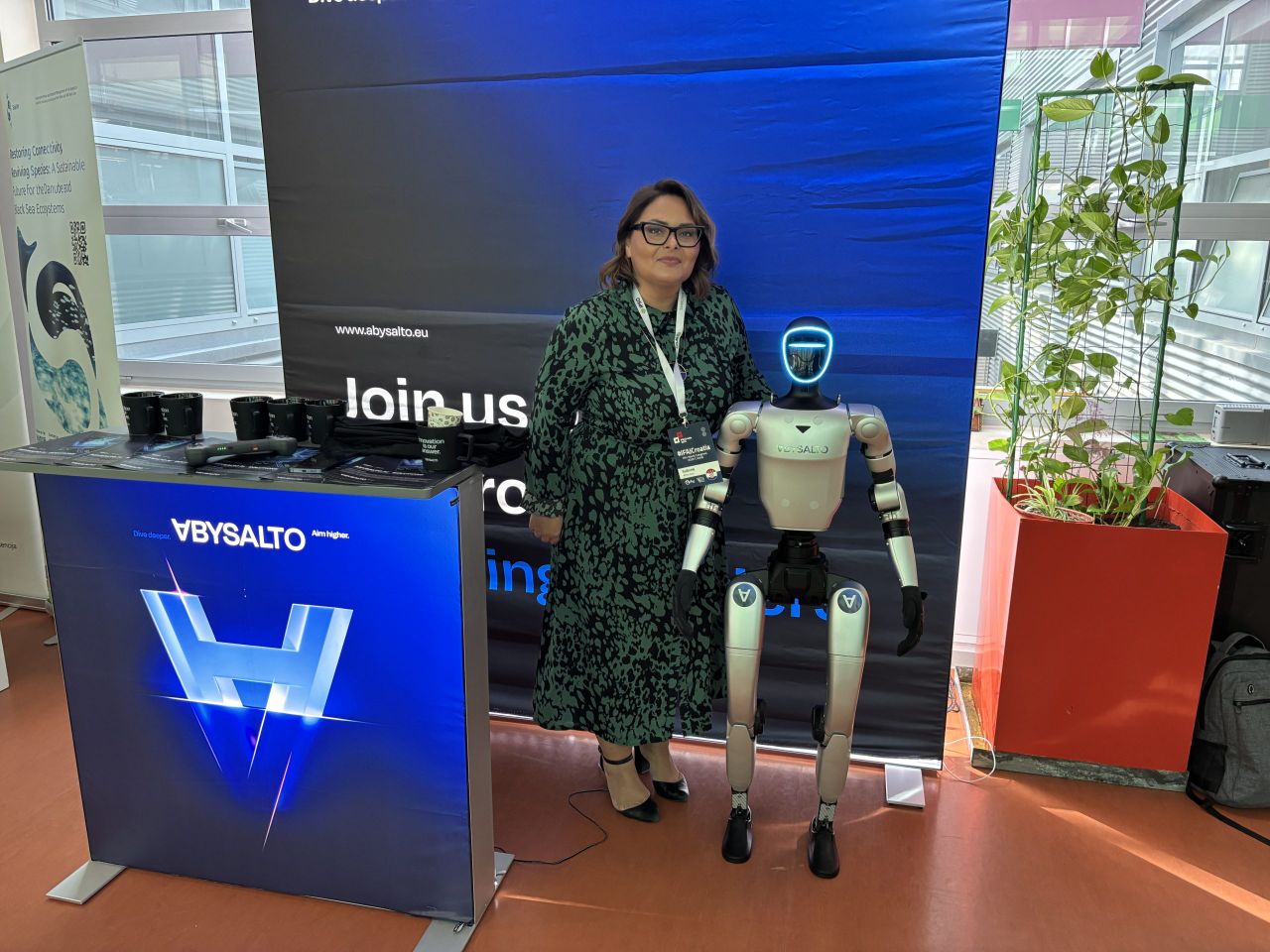 Maja Pavlinusic is the  head of marketing at Abysalto, pictured with a Unitree humanoid G1 robot
