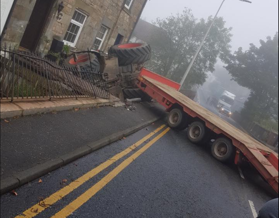 Tractor and low-loader involved in collision with house