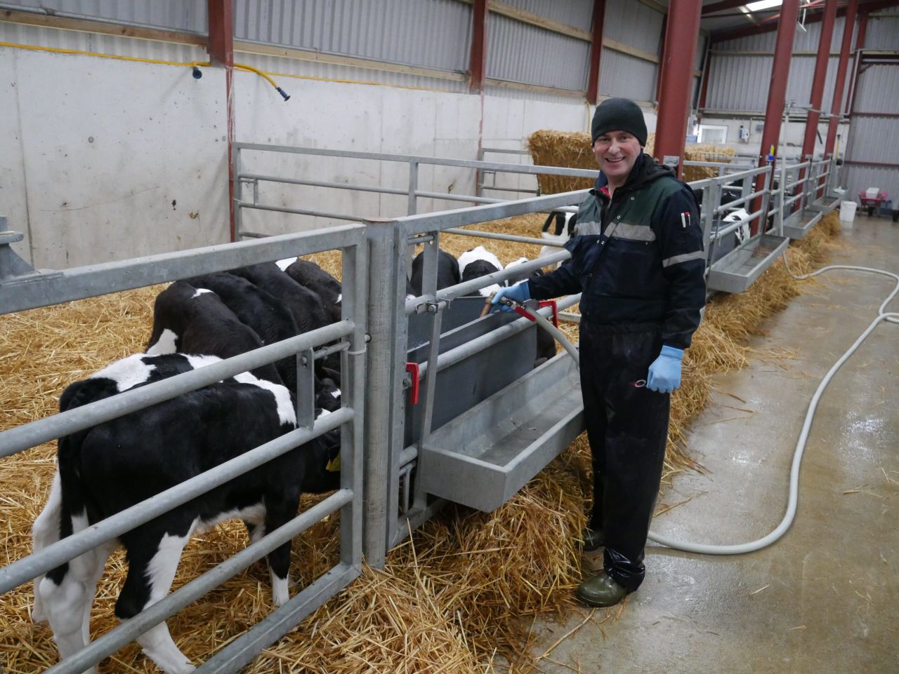 Donal Maher feeding calves on his farm in Co. Tipperary