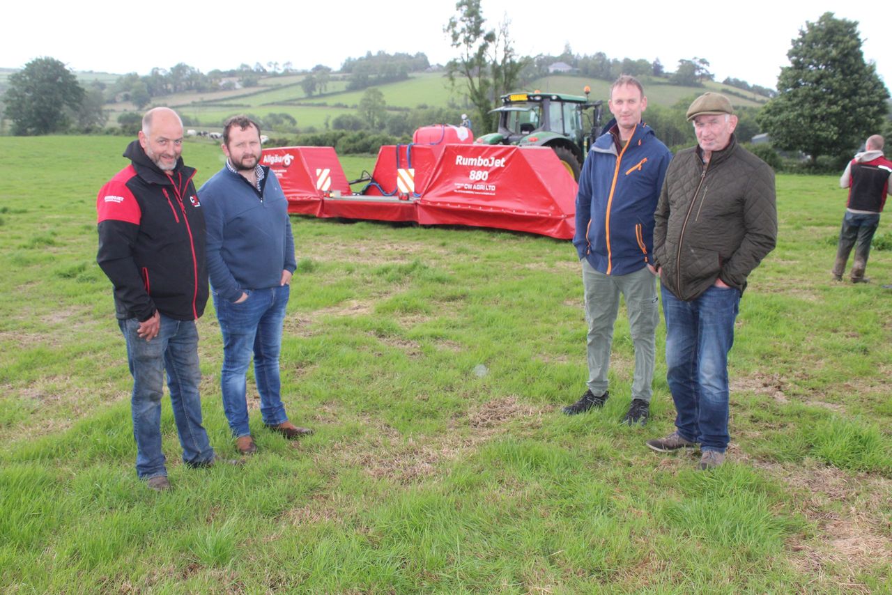Discussing the benefits of a computerised spot spraying system that specifically targets broadleaf weeds in grassland, (l-r): Stephen McKeown, C W Agri with Charles O'Shea, Padraig O'Mahoney, and Danny O'Mahoney, from Castleisland in Co. Kerry 