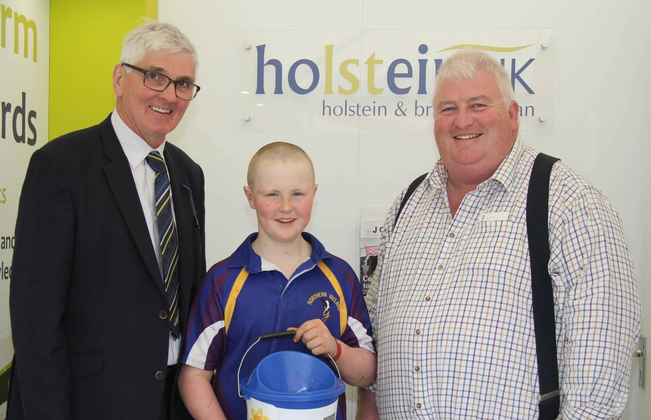 14-year-old raises £1,800 after shaving head for 'proud papa'