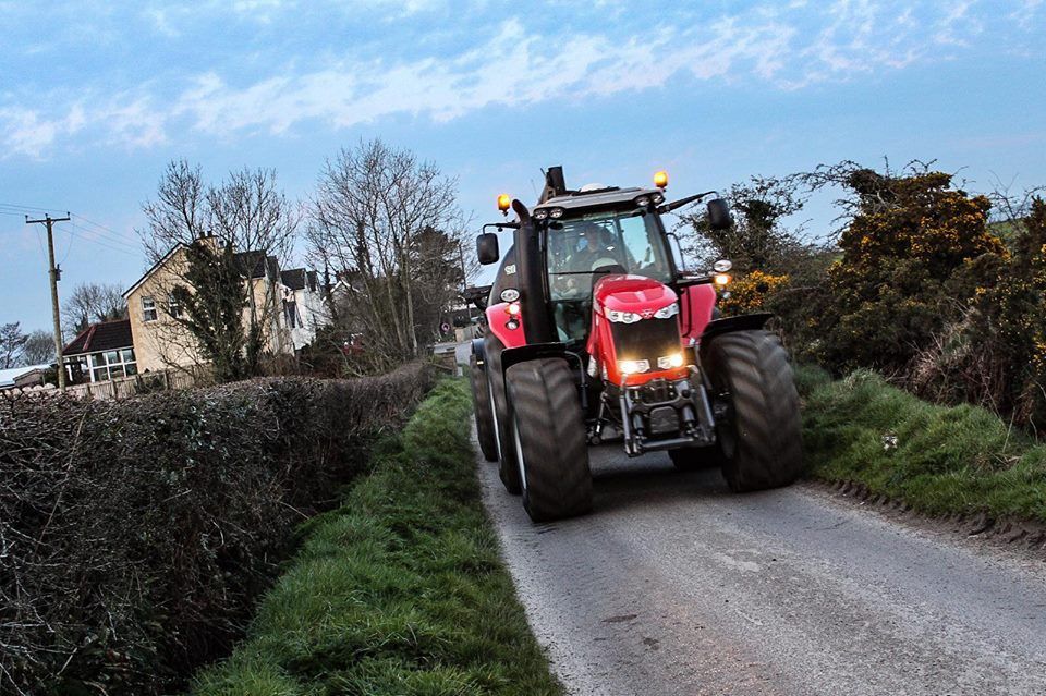 What lighting and visibility rules apply to tractors on the road?
