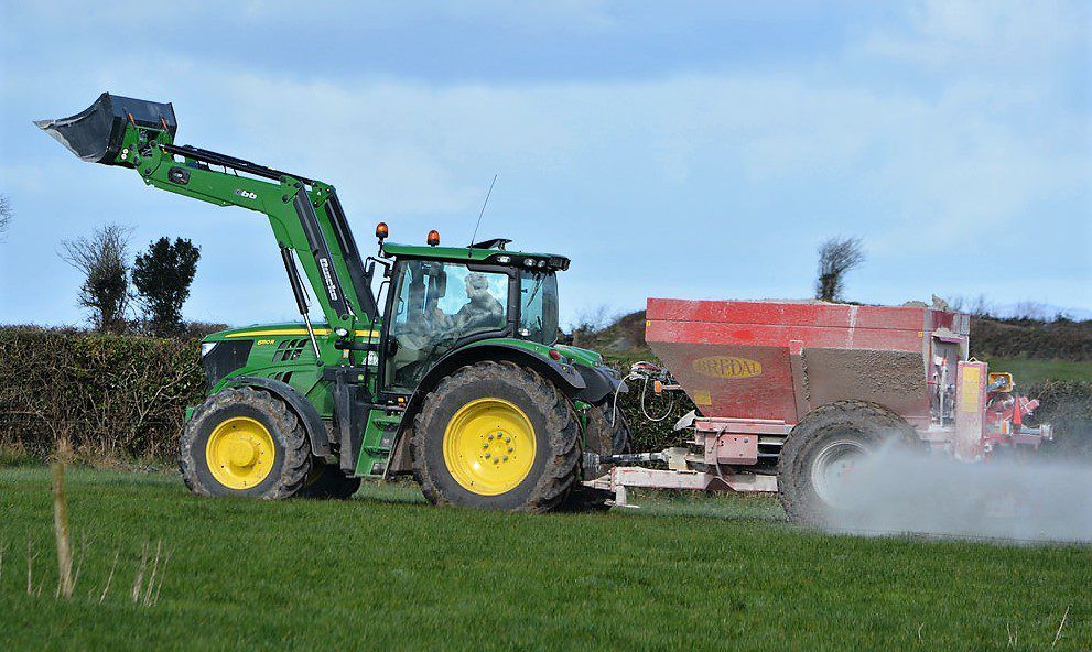 What are the benefits of correcting soil pH through lime?
