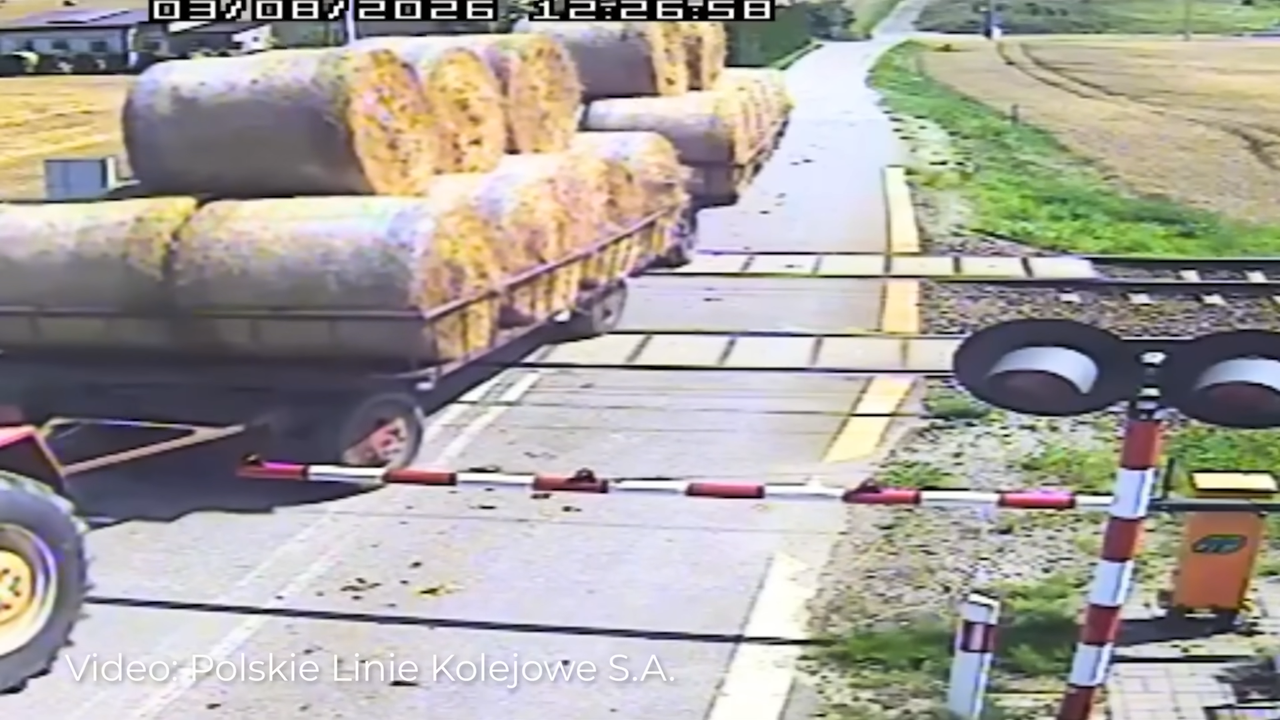 Train hits trailer after tractor driver stops on tracks
