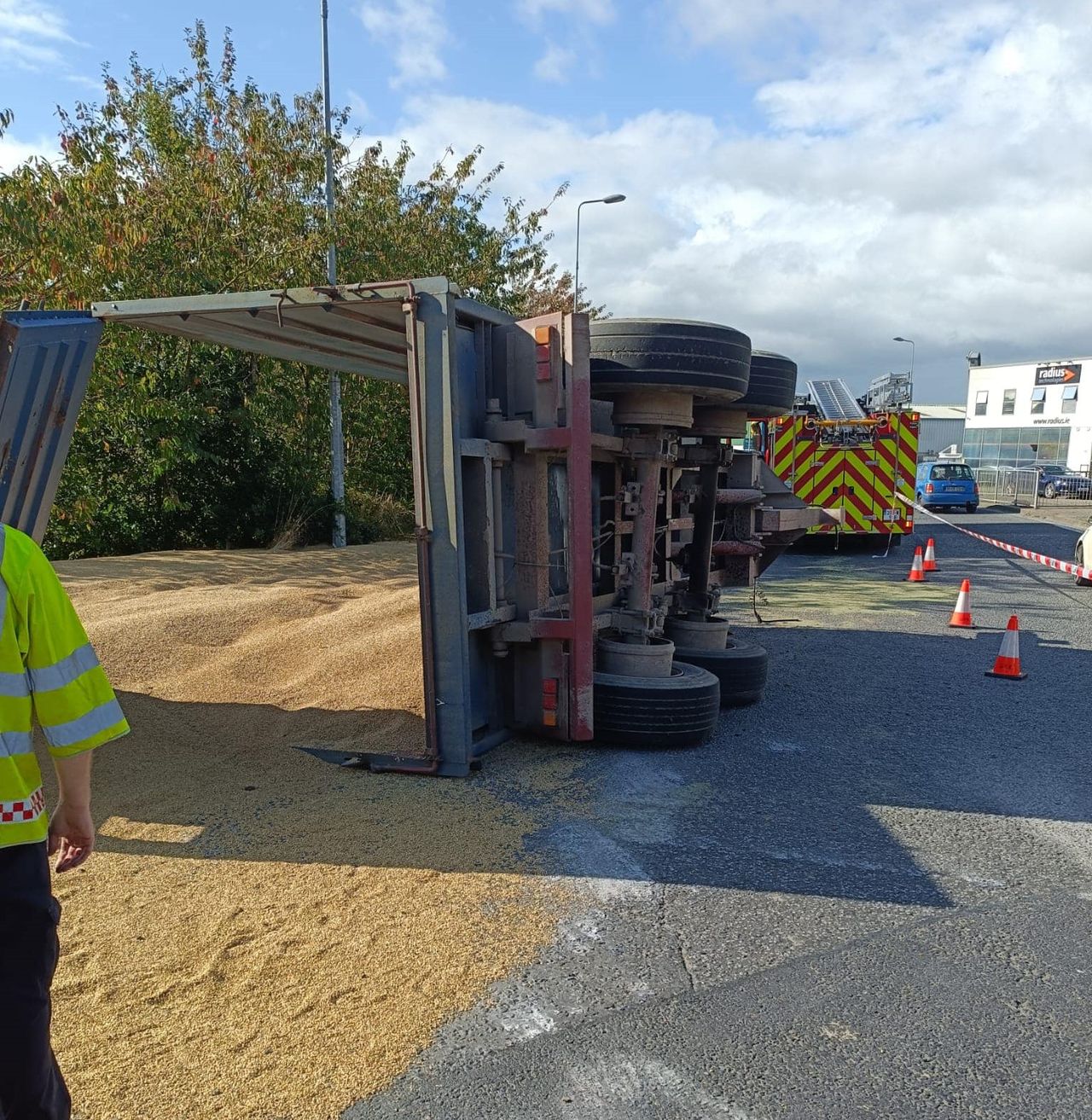 Grain spilled as trailer overturns in Waterford