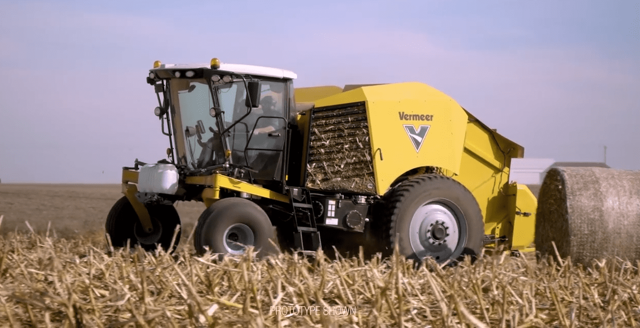 Self-propelled round baler moves on...to maize stalks
