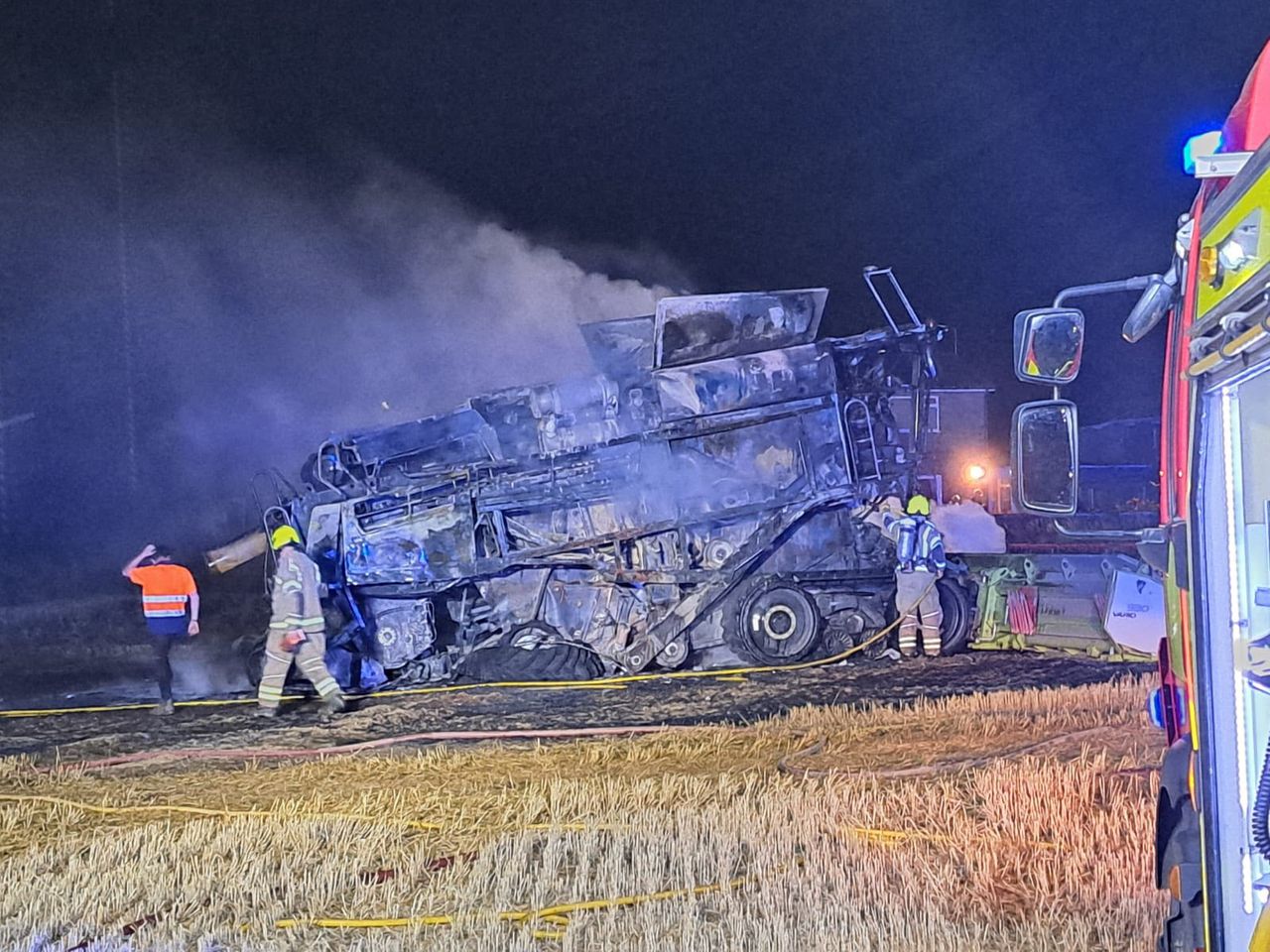 Fire crews and farmers tackle combine blaze in the UK