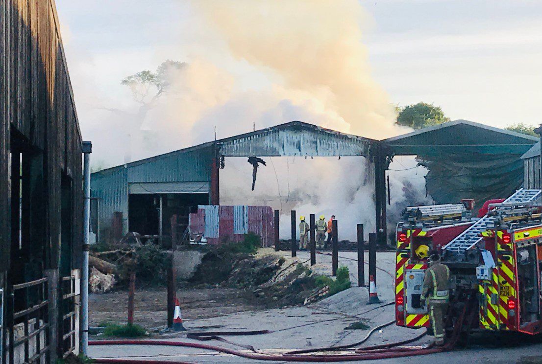 Firefighters tackle blaze affecting 6 barns on UK holding