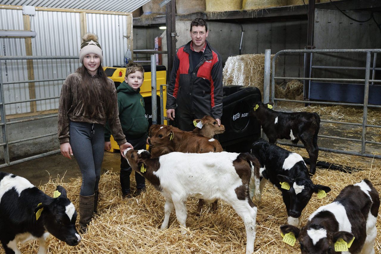 Michael Cahalane, Clonakilty, Co Cork along his children Sara and Dennis and young calves using the JFC Evolution Calf Feeder