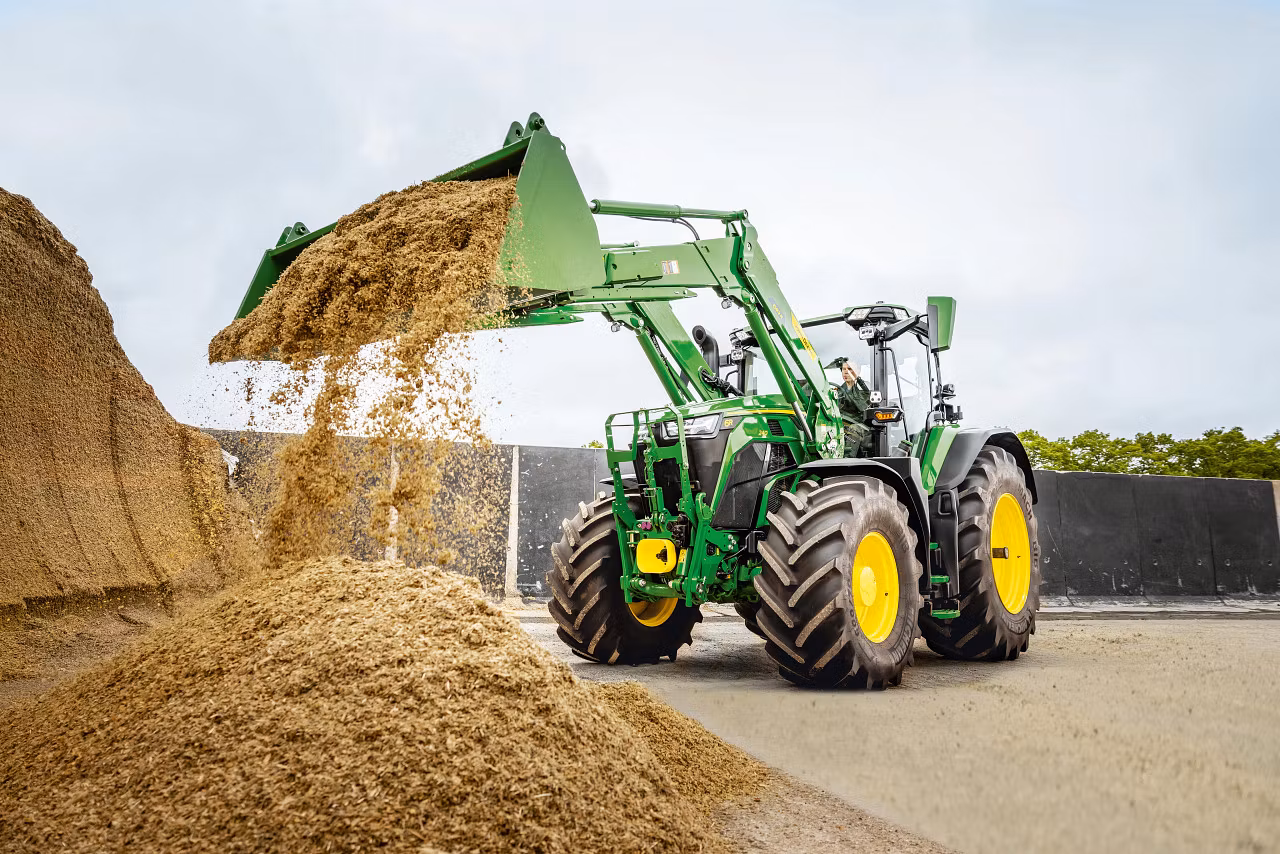 New John Deere 6R 240 using a front loader and bucket. Source: John Deere